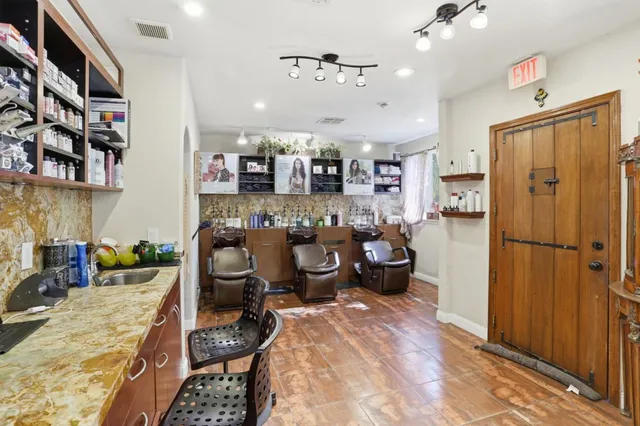 a living room with furniture and a mirror
