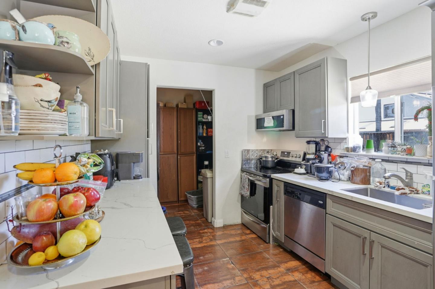 3630 San Felipe Road San Jose, CA 95135 - Photo 16 of 22 a kitchen with stainless steel appliances kitchen island granite countertop a sink and cabinets