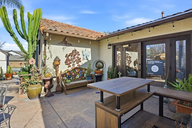 a view of a chairs and tables in patio