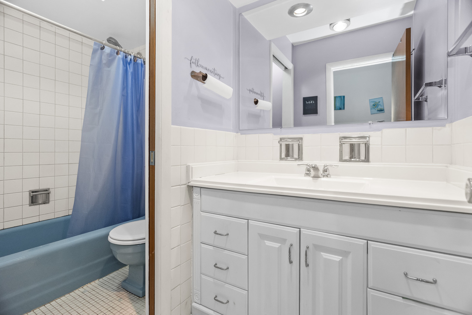 250 Ridge Avenue, Unit 2J Evanston, IL 60202 - Photo 13 of 18 a bathroom with a sink a toilet and shower