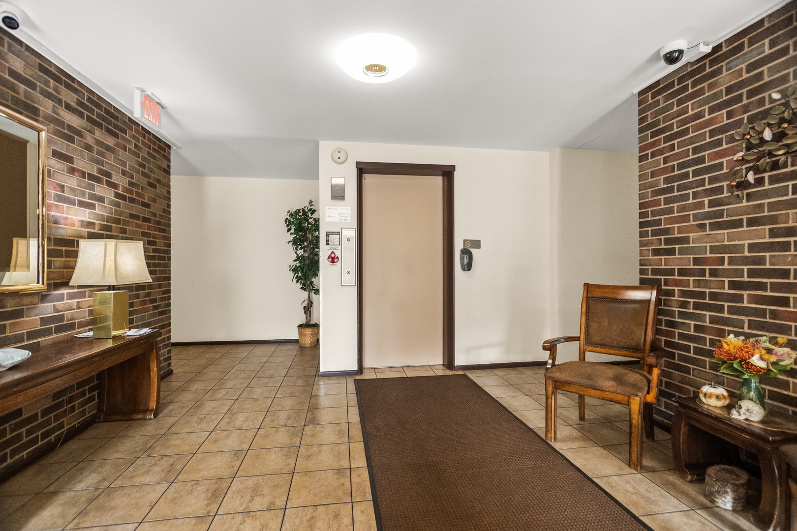 250 Ridge Avenue, Unit 2J Evanston, IL 60202 - Photo 2 of 18 a living room with stainless steel appliances furniture a rug and a window