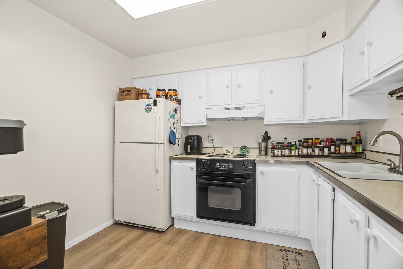 250 Ridge Avenue, Unit 2J Evanston, IL 60202 - Photo 7 of 18 a kitchen with stainless steel appliances granite countertop a refrigerator sink and stove