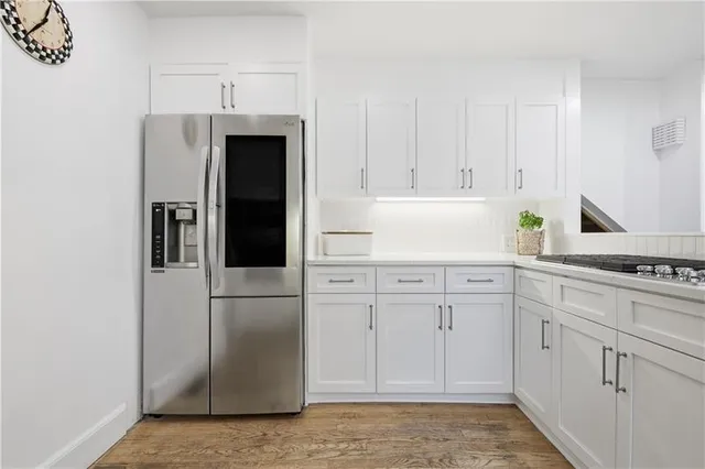 a living room with furniture a rug and a window