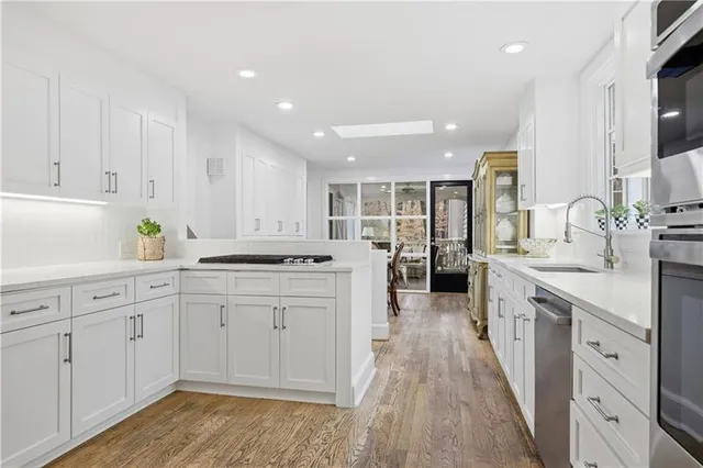 a living room with fireplace furniture and a flat screen tv