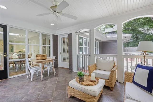 a view of a wooden deck and a yard