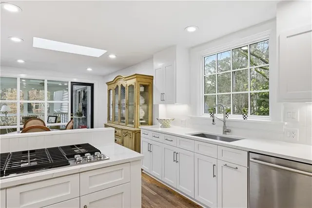 a kitchen with cabinets and stainless steel appliances