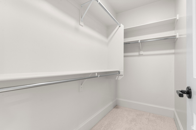 11718 South Halls Crk Road Draper, UT 84020 - Photo 27 of 28 Walk-in closet featuring white shelving and chrome hanging rods