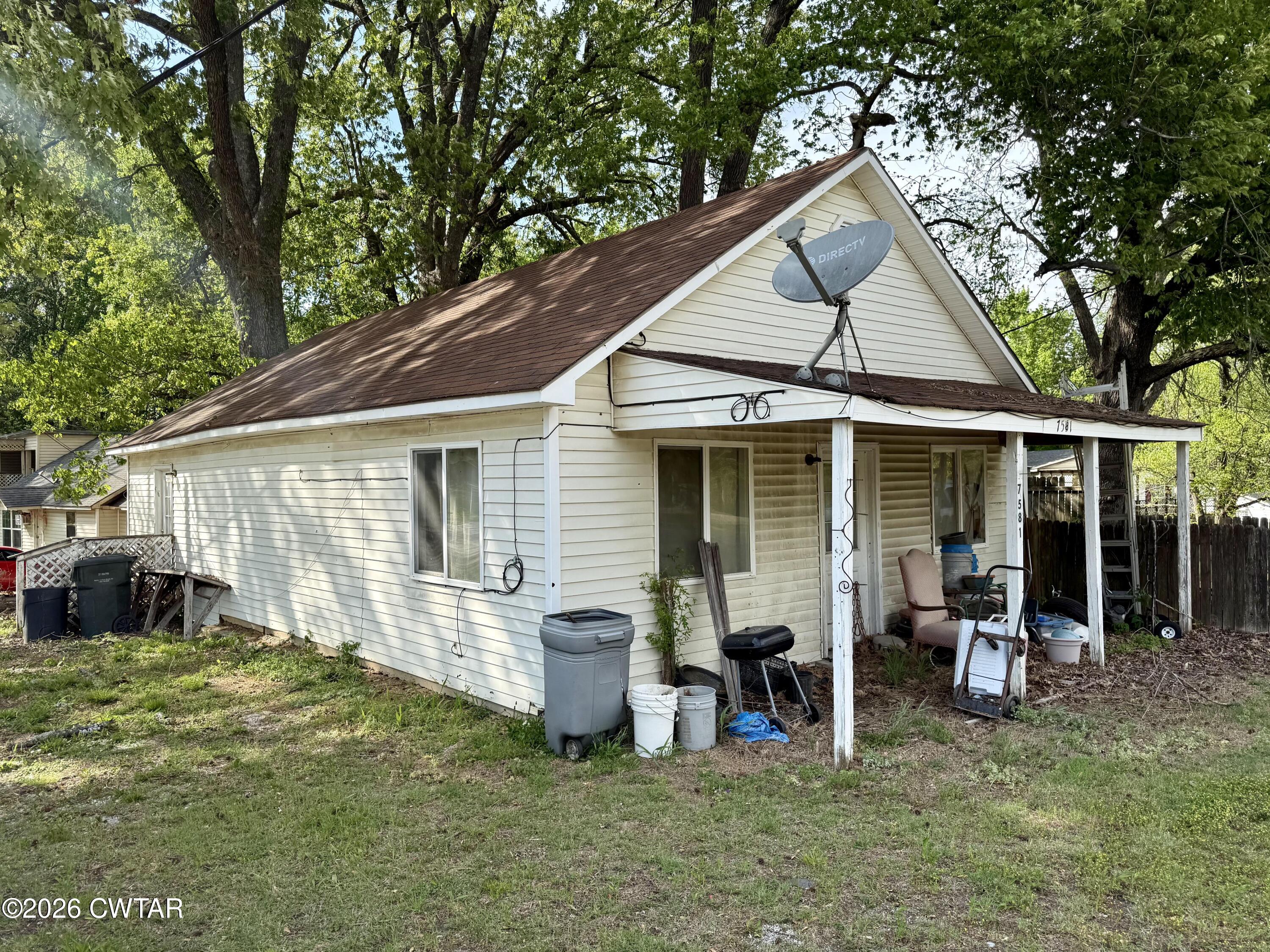 7581 Highway 189 Friendship, TN 38034 - Photo 3 of 8 a view of a house with backyard