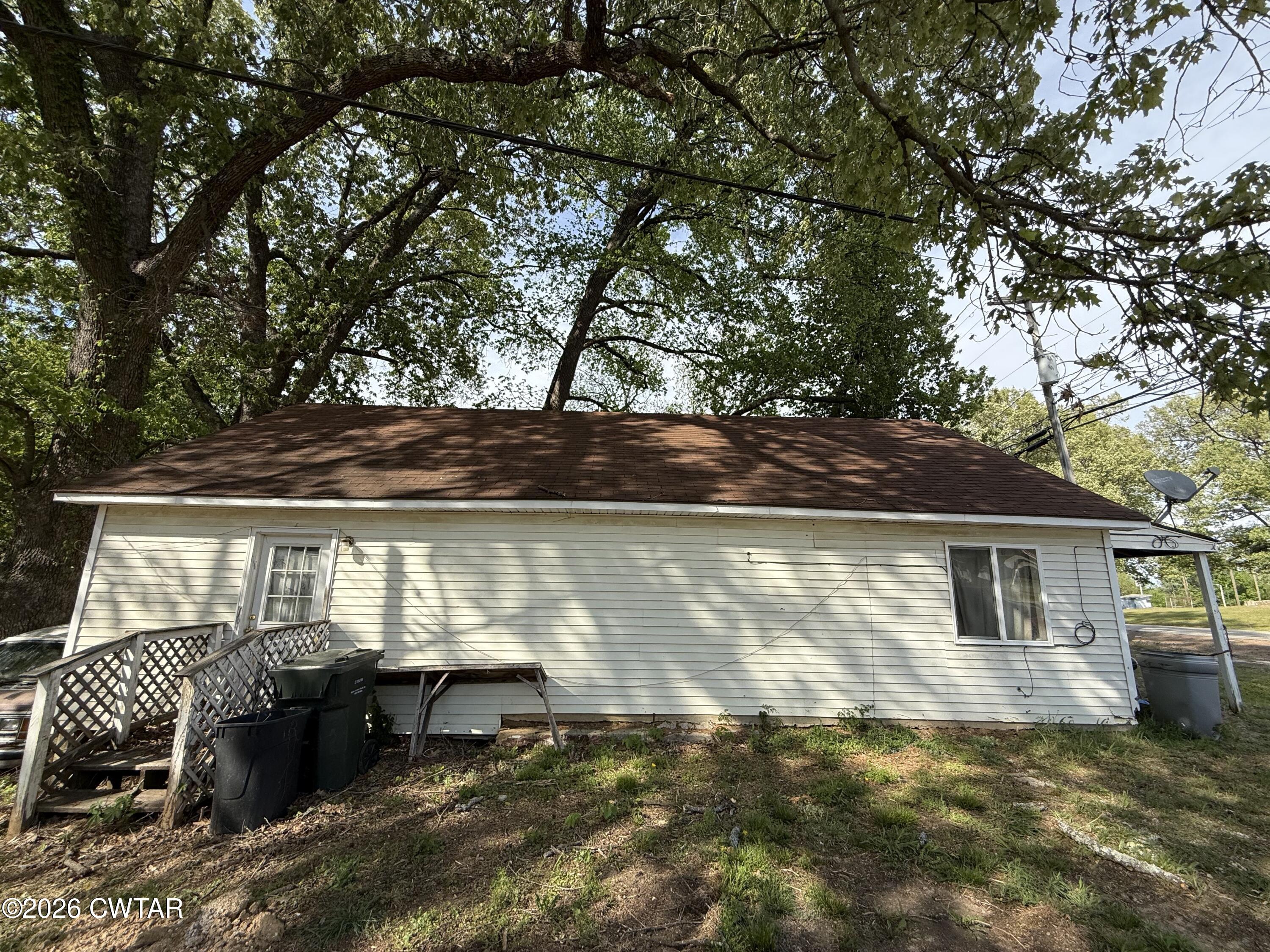 7581 Highway 189 Friendship, TN 38034 - Photo 6 of 8 a view of house with backyard and sitting area