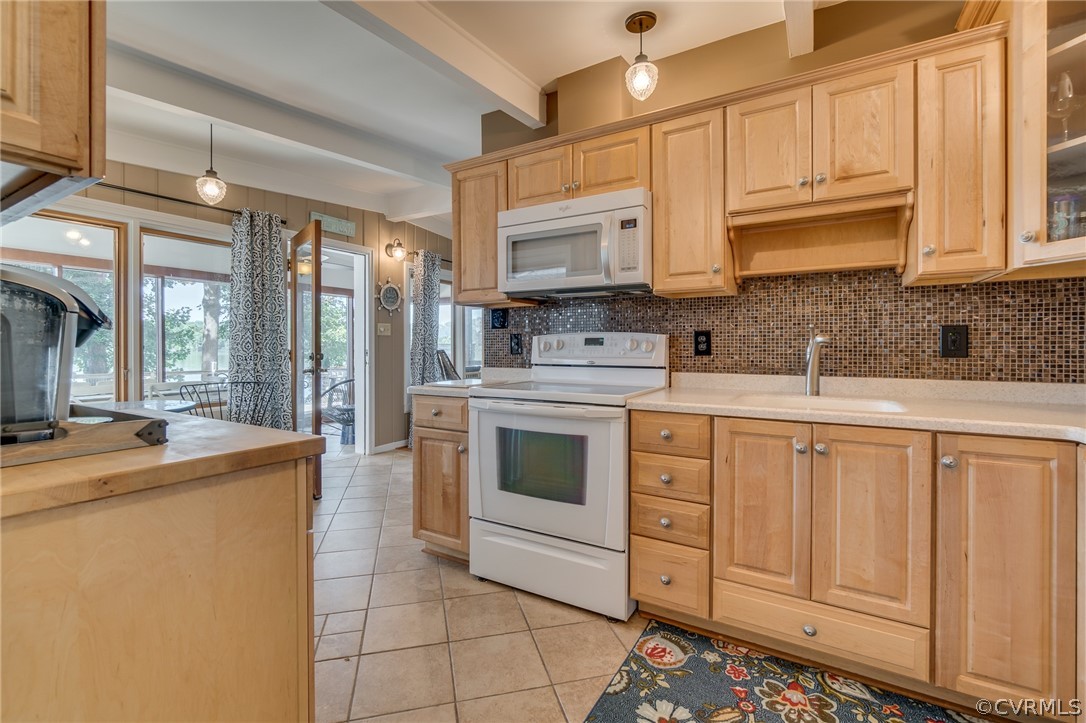 6279 Holly Trail Gloucester, VA 23061 - Photo 16 of 45 a kitchen with stainless steel appliances granite countertop a sink a stove and cabinets