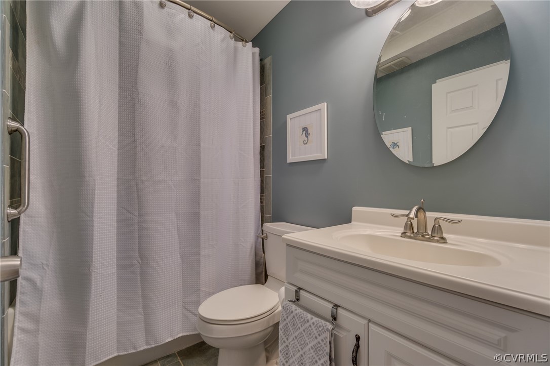 6279 Holly Trail Gloucester, VA 23061 - Photo 24 of 45 a bathroom with a sink toilet and mirror