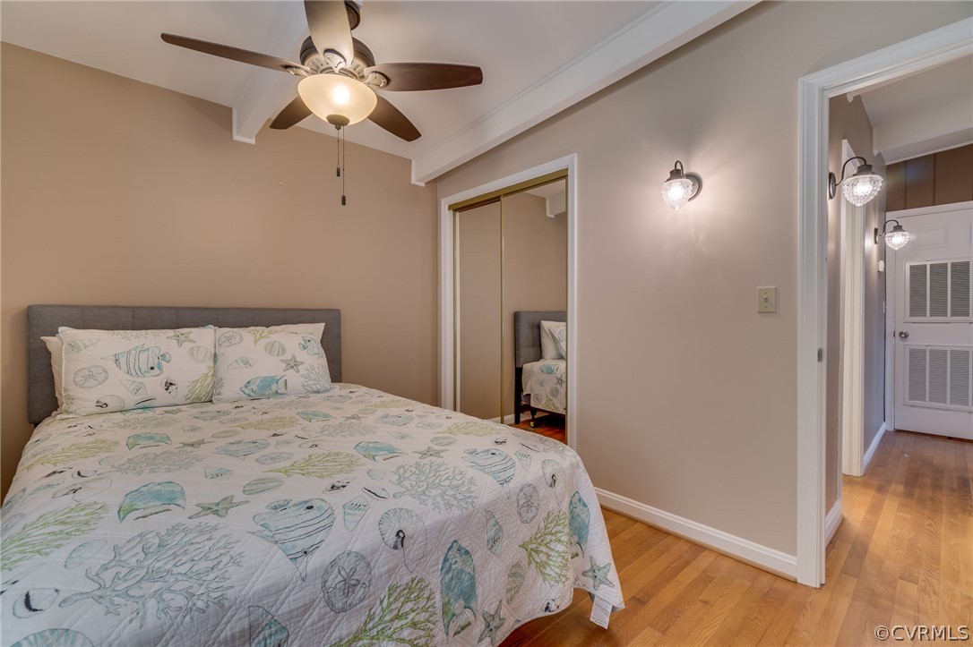 6279 Holly Trail Gloucester, VA 23061 - Photo 27 of 45 a bedroom with a bed and a chandelier