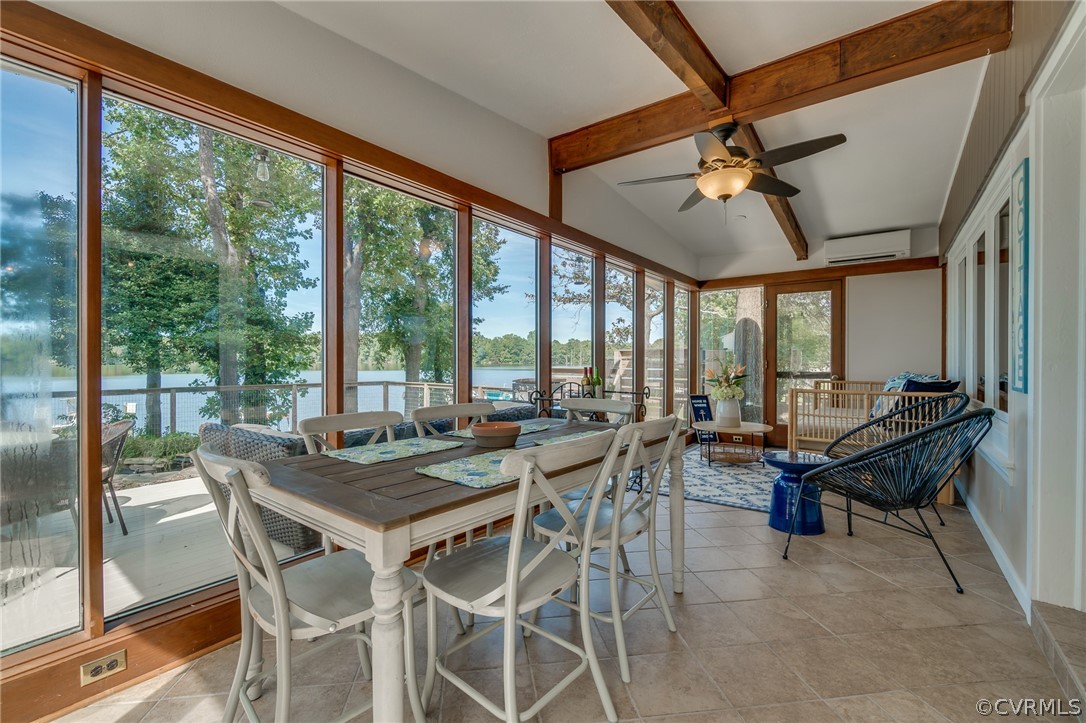 6279 Holly Trail Gloucester, VA 23061 - Photo 28 of 45 a view of a dining room with furniture large windows and wooden floor