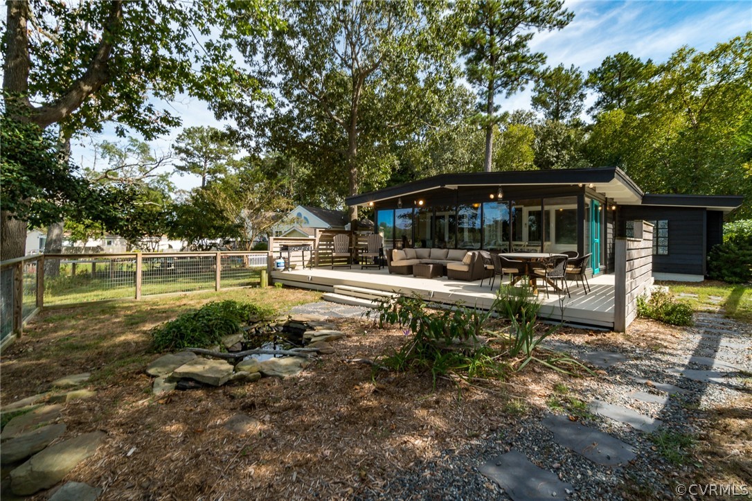 6279 Holly Trail Gloucester, VA 23061 - Photo 33 of 45 a view of a lake with a bench and trees