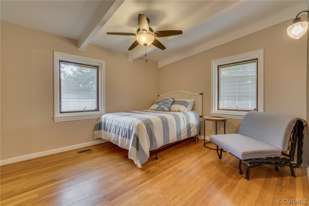 6279 Holly Trail Gloucester, VA 23061 - Photo 44 of 45 a bedroom with a bed wooden floor and window