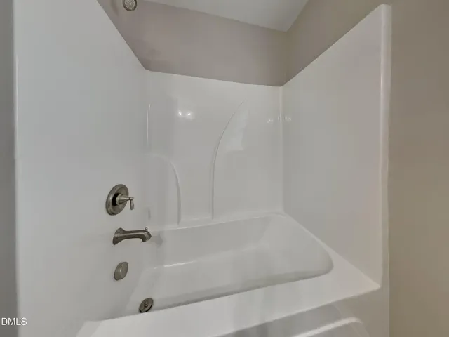 a bathroom with a toilet a sink and a mirror