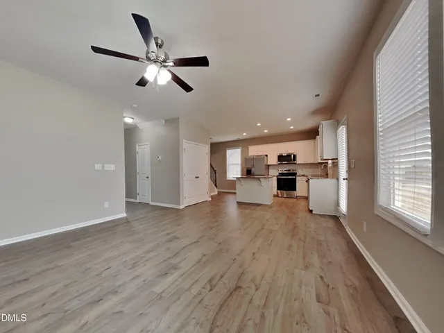 a view of kitchen with cabinets and wooden floor