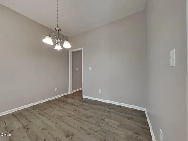 a view of livingroom with chandelier fan