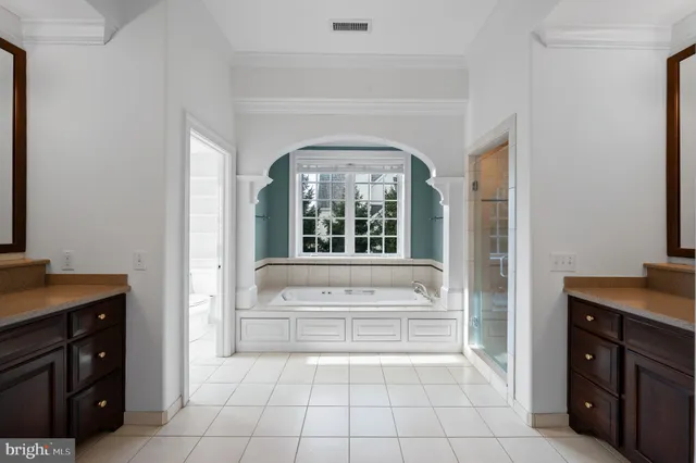 a bathroom with a sink vanity and a mirror