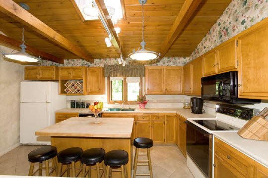 15925 Sharp Road Rockton, IL 61072 - Photo 3 of 6 a kitchen with a sink a stove and chairs