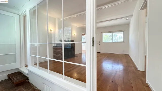 a view of entryway with wooden floor