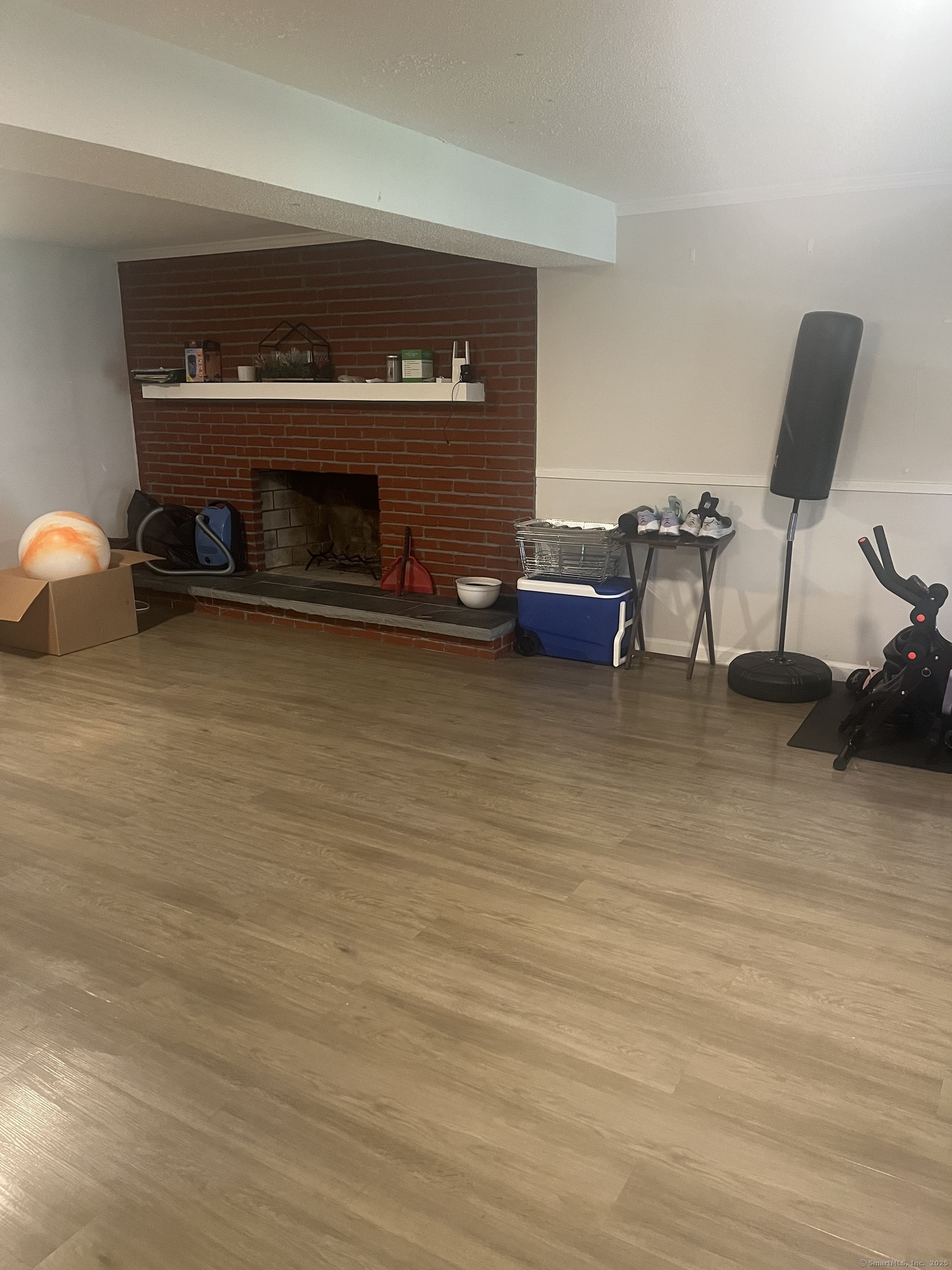 62 Haddad Road Waterbury, CT 06708 - Photo 12 of 15 a living room with furniture and a fireplace