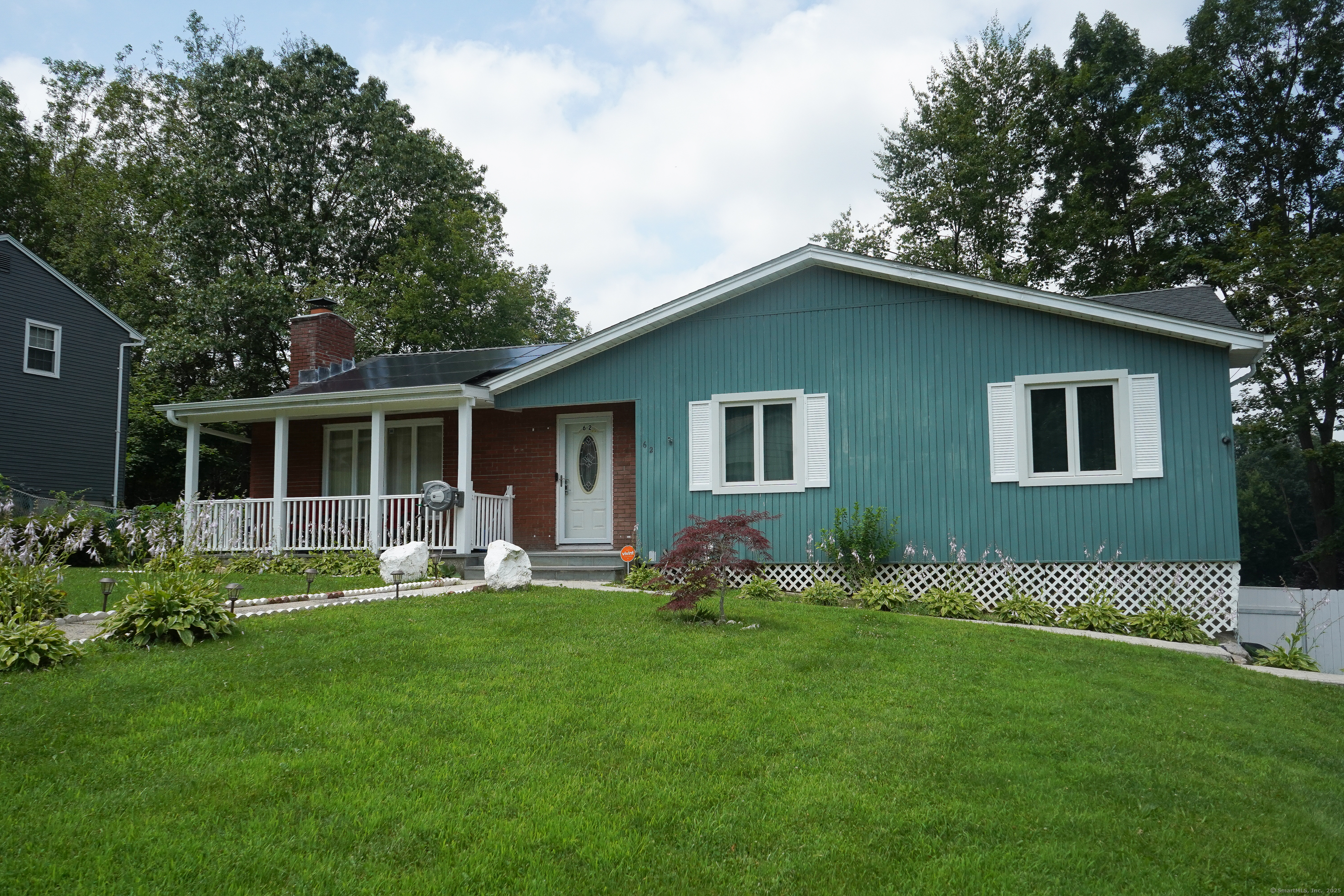 62 Haddad Road Waterbury, CT 06708 - Photo 2 of 15 a front view of house with yard and green space
