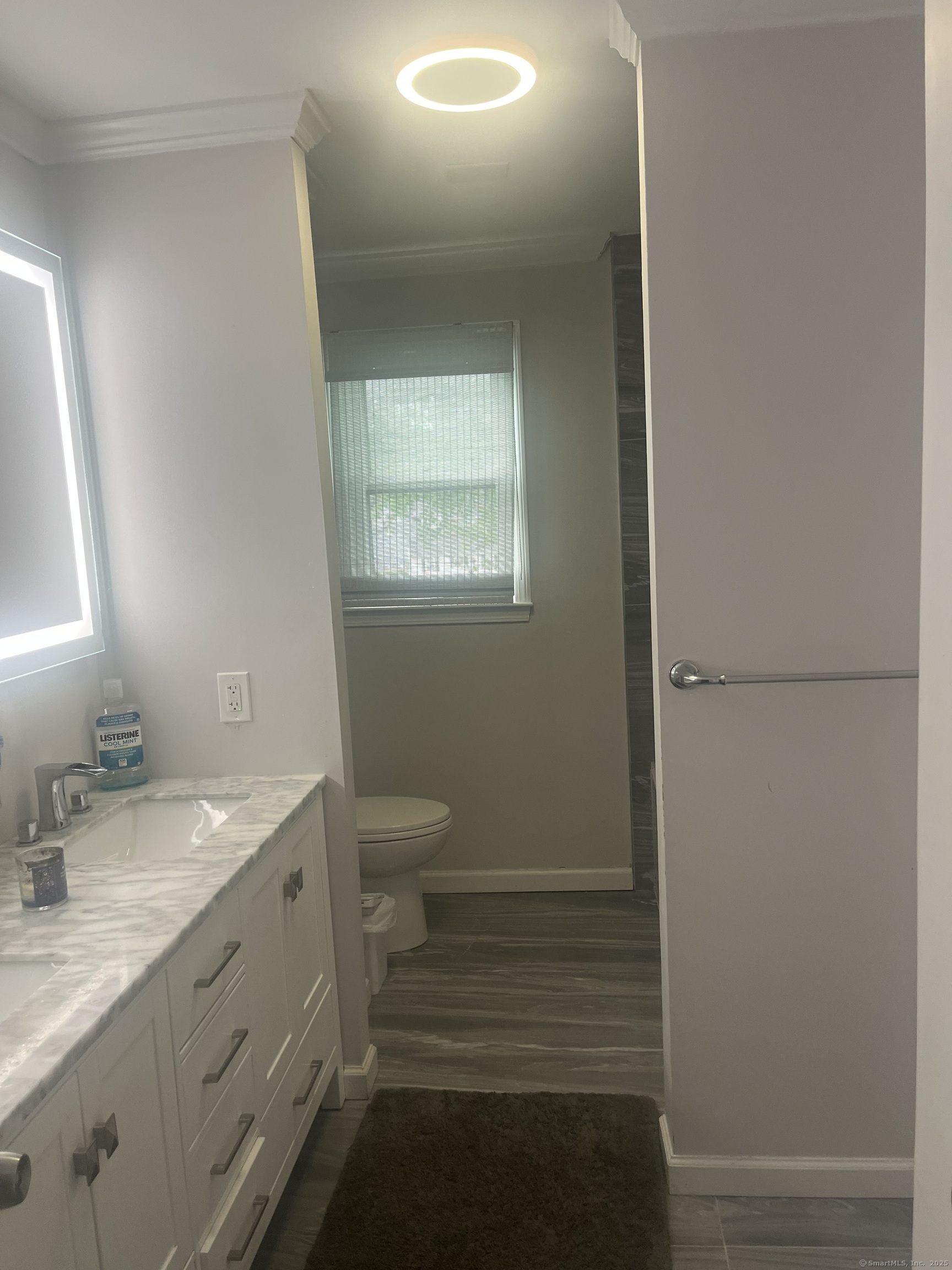 62 Haddad Road Waterbury, CT 06708 - Photo 10 of 15 a bathroom with a toilet a sink and mirror