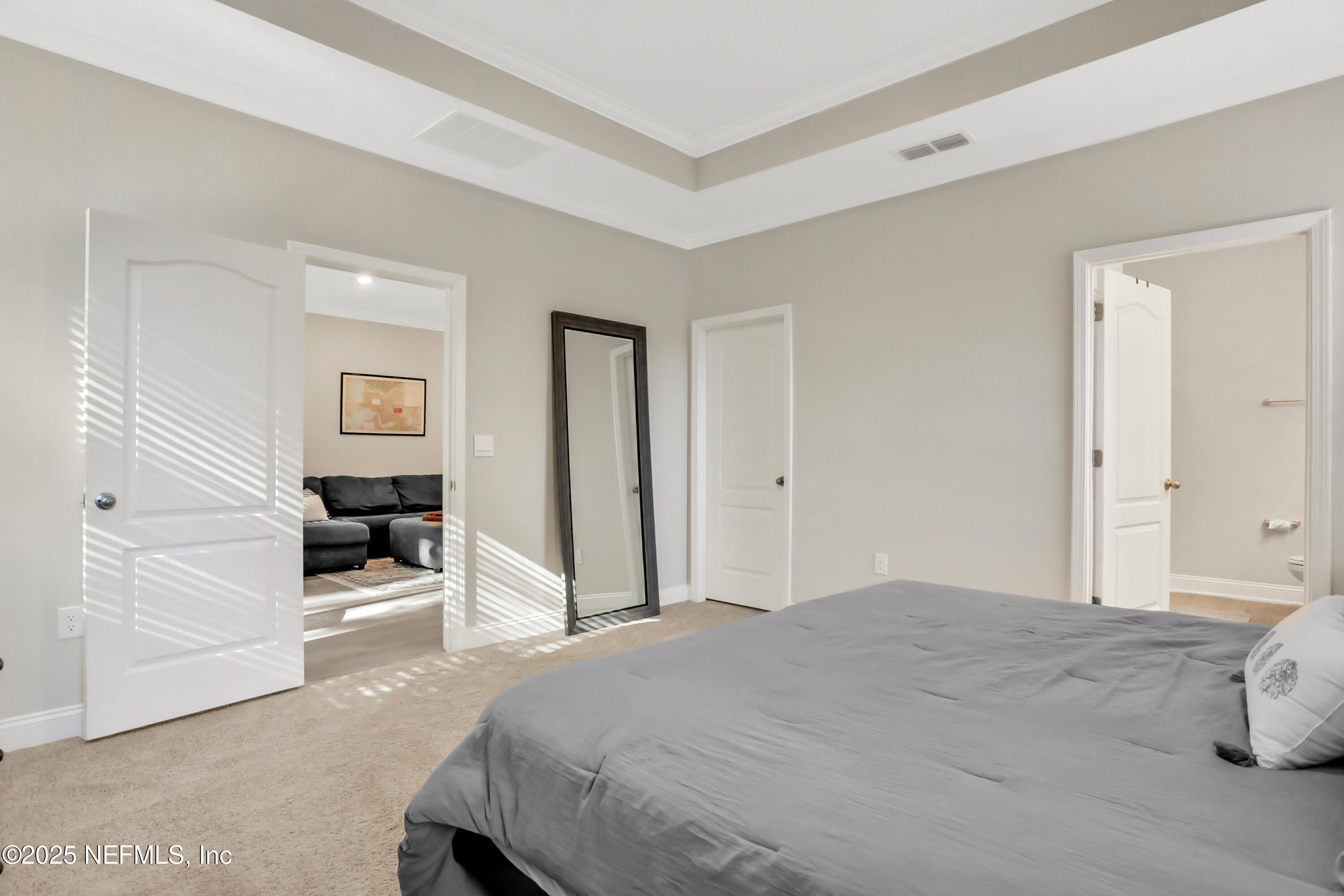 404 Thistleton Way Street St. Augustine, FL 32092 - Photo 14 of 36 a bedroom with a white bed and white walls