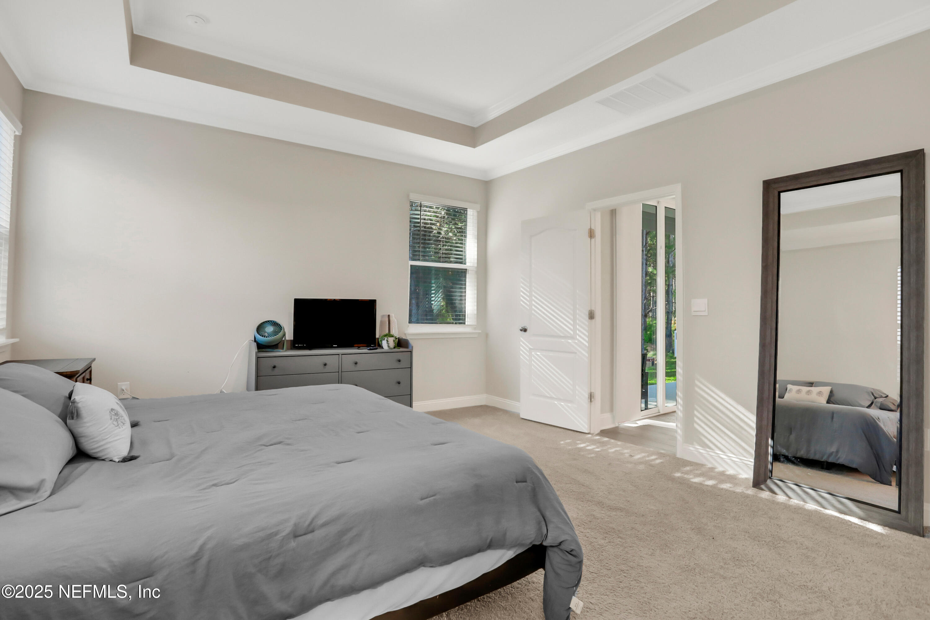 404 Thistleton Way Street St. Augustine, FL 32092 - Photo 15 of 36 a bedroom with a bed and a couch