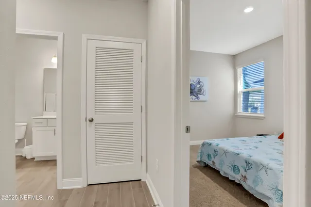 a bedroom with a bed and a walk in closet