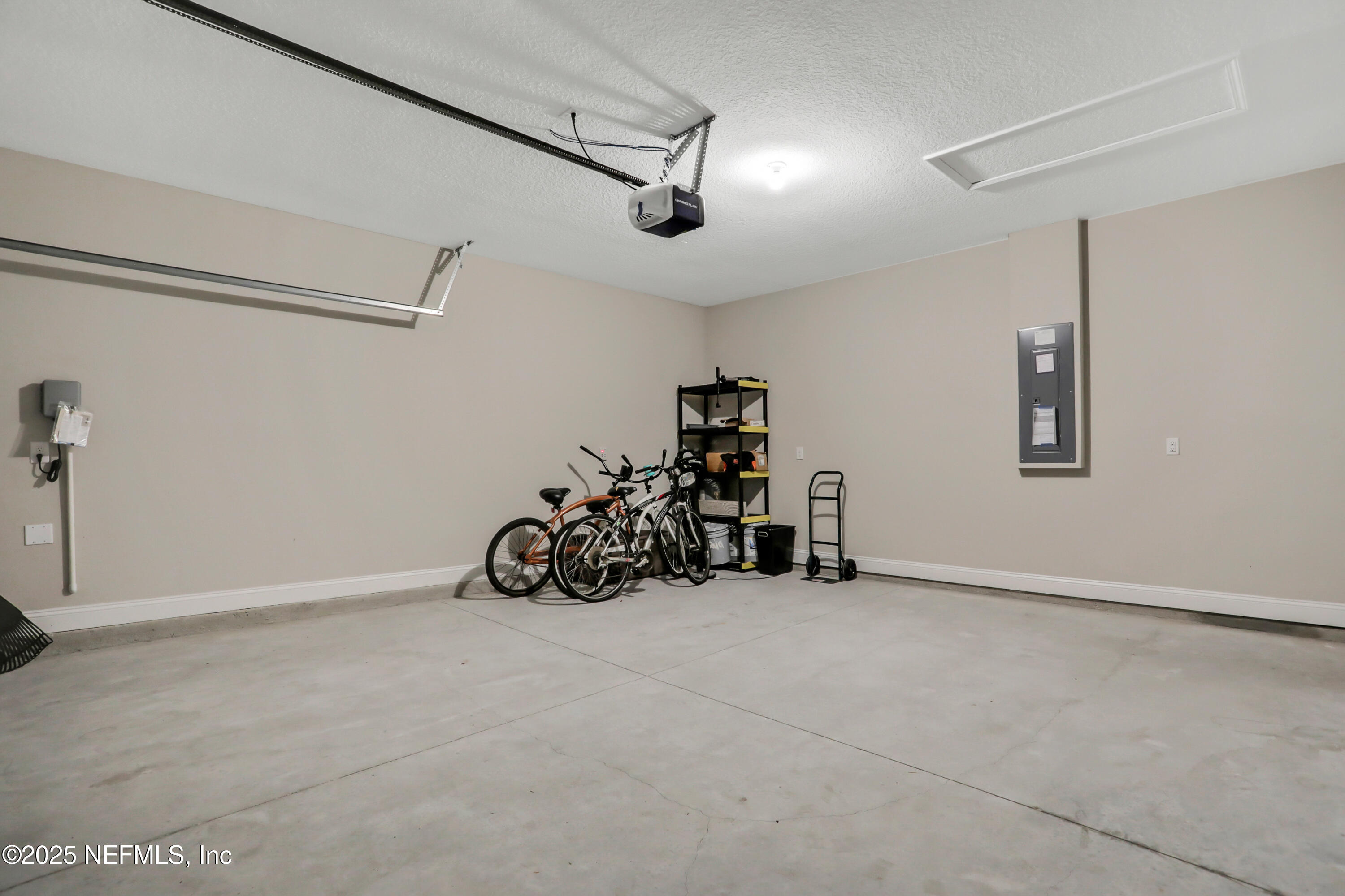 404 Thistleton Way Street St. Augustine, FL 32092 - Photo 29 of 36 a view of a garage with rack and bicycle