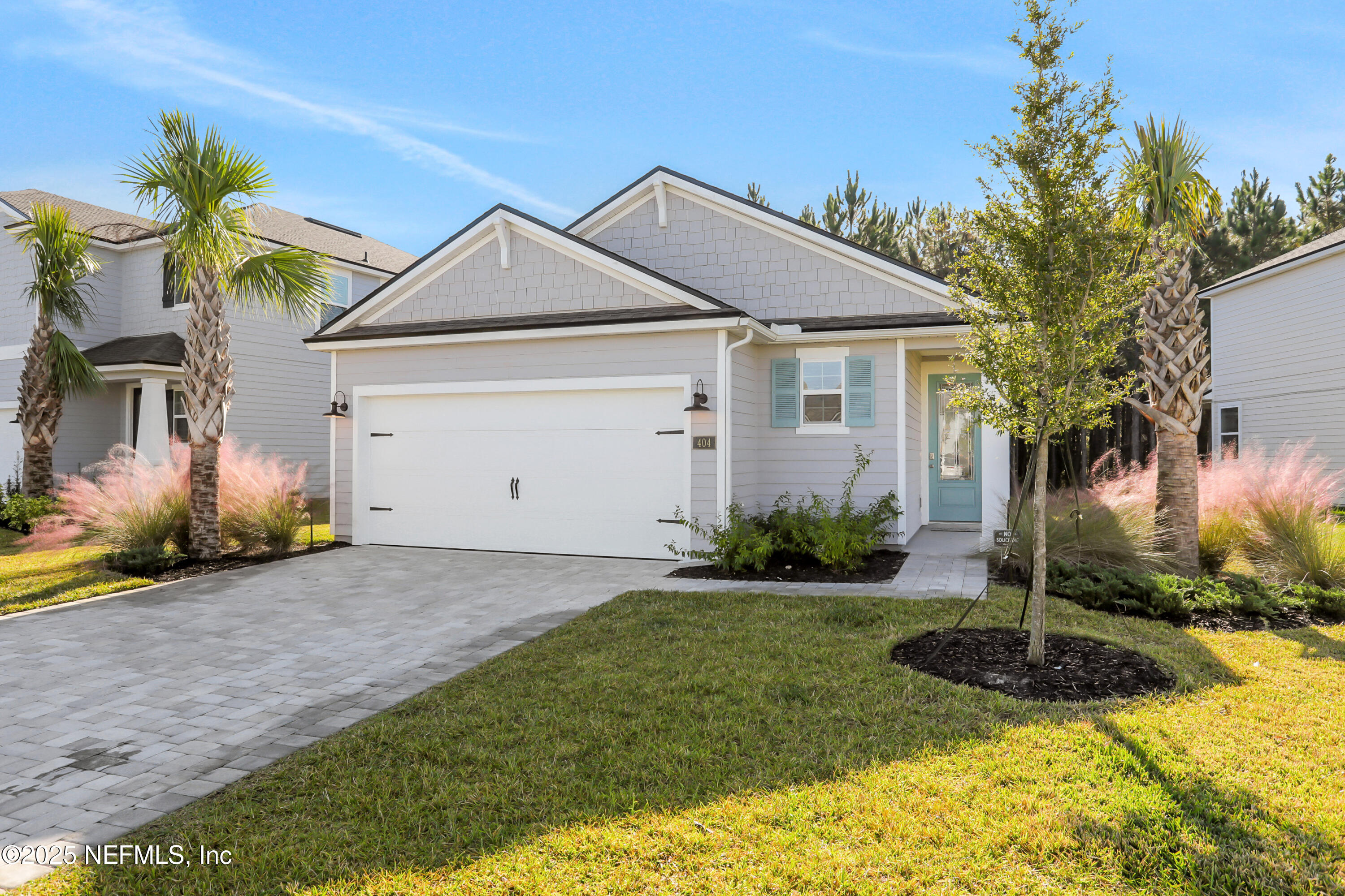 404 Thistleton Way Street St. Augustine, FL 32092 - Photo 31 of 36 a front view of a house with garden