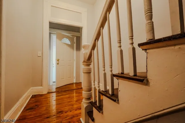 a view of front door with wooden floor
