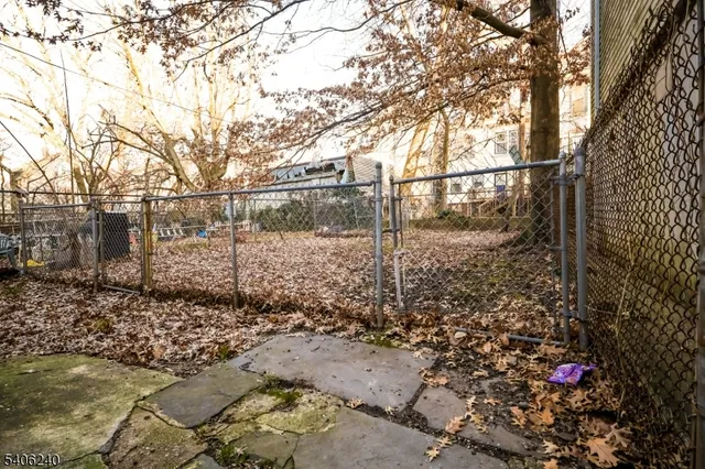 a view of a yard with a tree