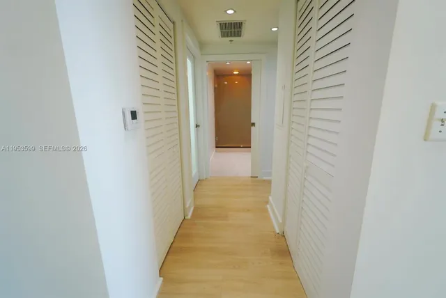 a view of a hallway with a white door