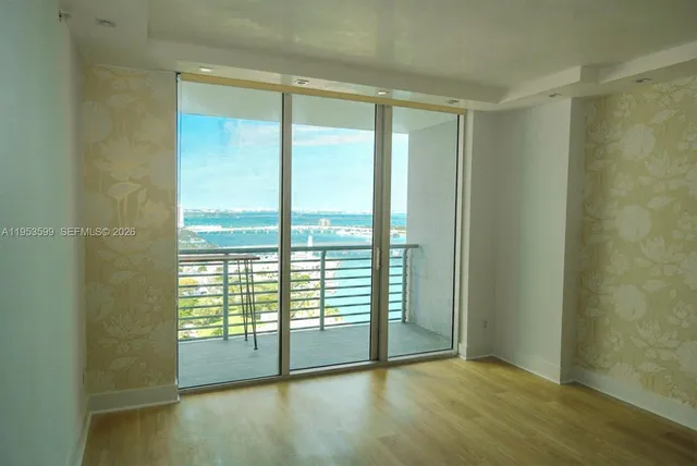 a view of an empty room and window