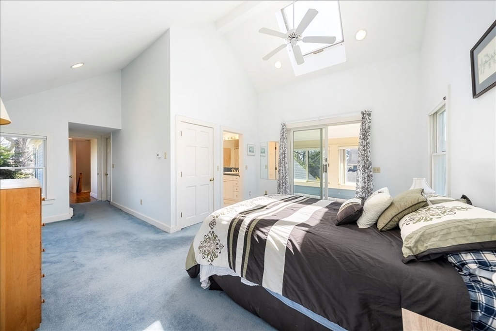 10 2nd Street Natick, MA 01760 - Photo 17 of 31 a bedroom with bed and a chandelier