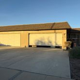 a view of backyard of a house