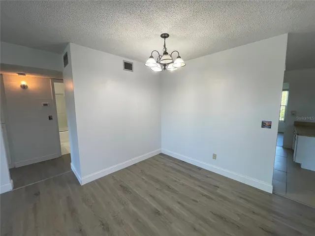 a kitchen with cabinets and window