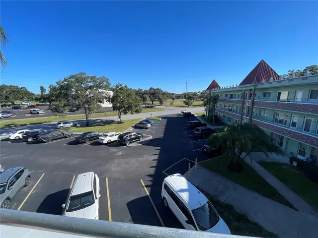 a view of a swimming pool with a balcony