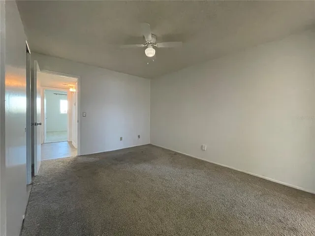 a bathroom with a toilet a sink and a mirror