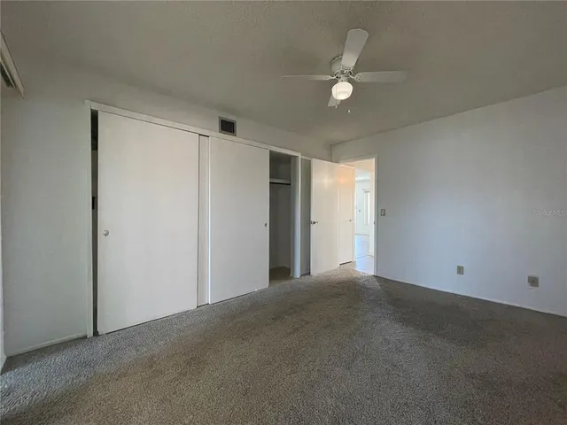 a bathroom with a sink and mirror with toilet