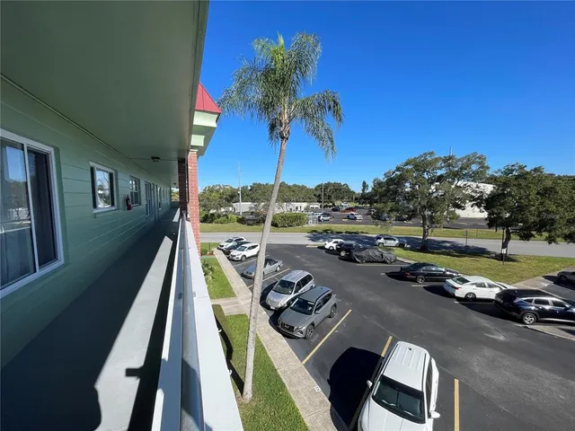 a view of an empty room and wooden floor
