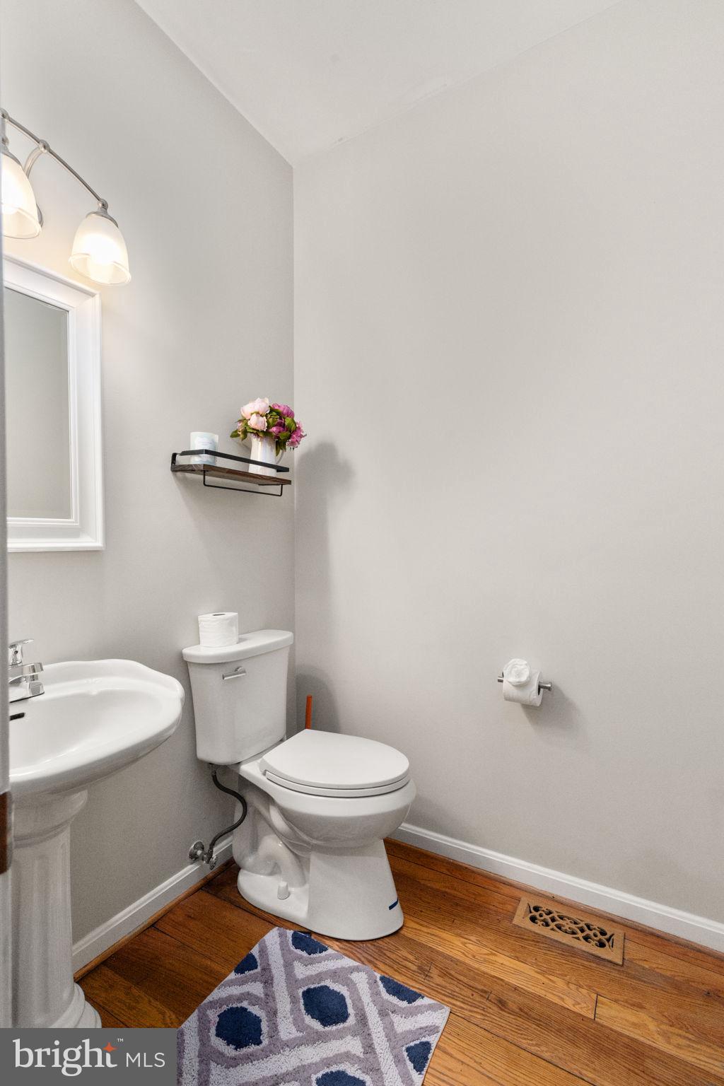 2140 Marston Road New Windsor, MD 21776 - Photo 22 of 48 a bathroom with a sink a toilet and a mirror