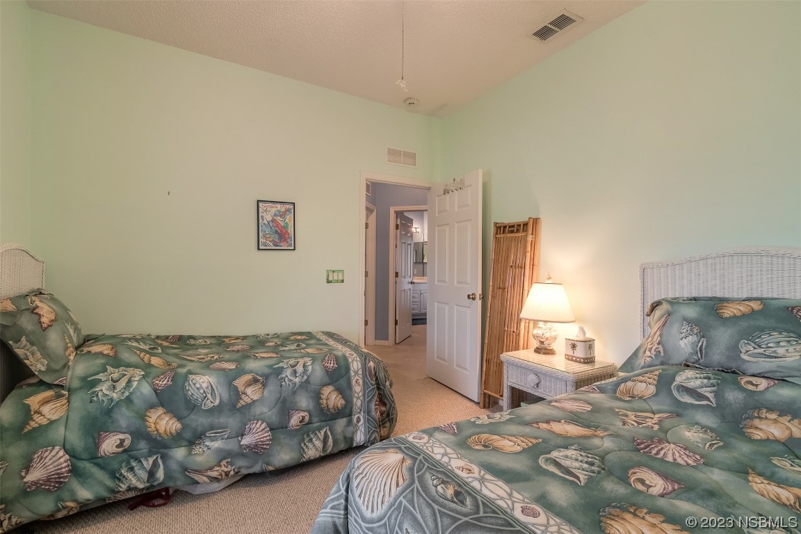 313 Mariners Gate Drive Edgewater, FL 32141 - Photo 11 of 55 a bedroom with a bed and a couch