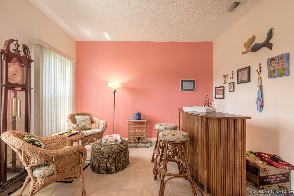 313 Mariners Gate Drive Edgewater, FL 32141 - Photo 14 of 55 a balcony with furniture and a potted plant