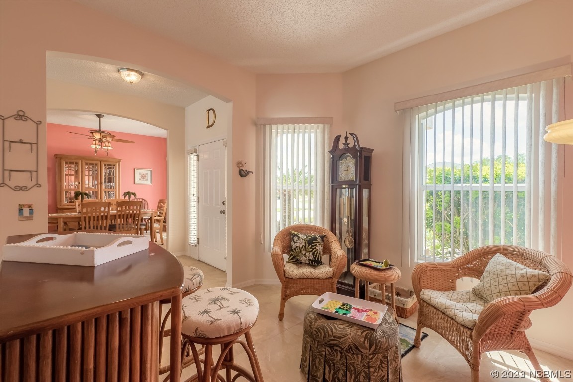 313 Mariners Gate Drive Edgewater, FL 32141 - Photo 15 of 55 a living room with furniture and a large window