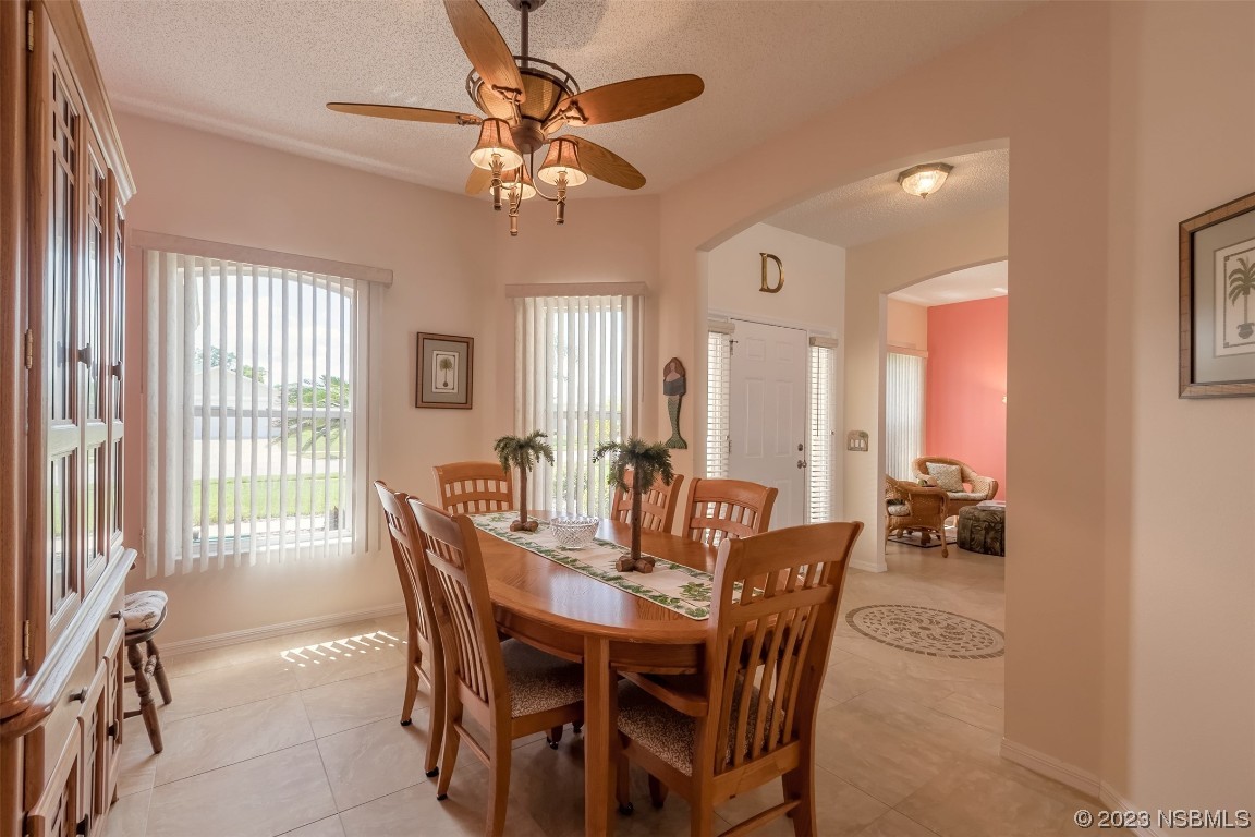 313 Mariners Gate Drive Edgewater, FL 32141 - Photo 17 of 55 a view of a dining room with furniture window and outside view