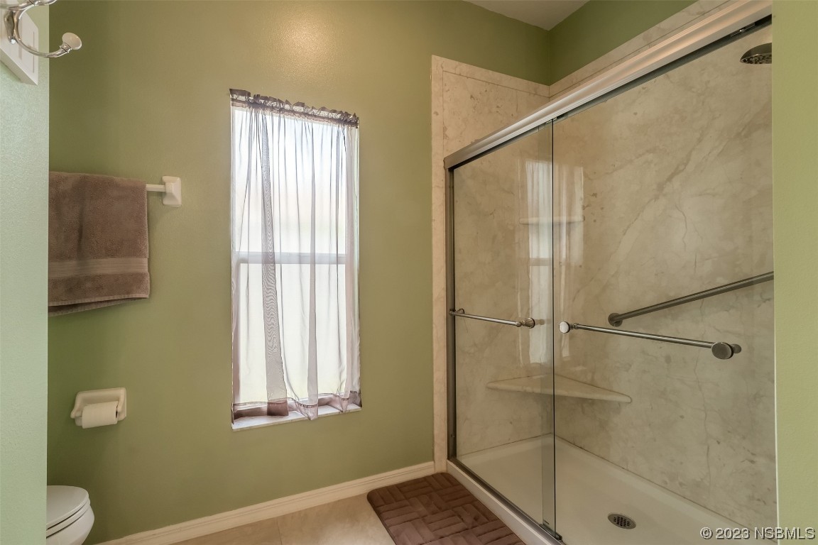 313 Mariners Gate Drive Edgewater, FL 32141 - Photo 23 of 55 a bathroom with a shower and a toilet